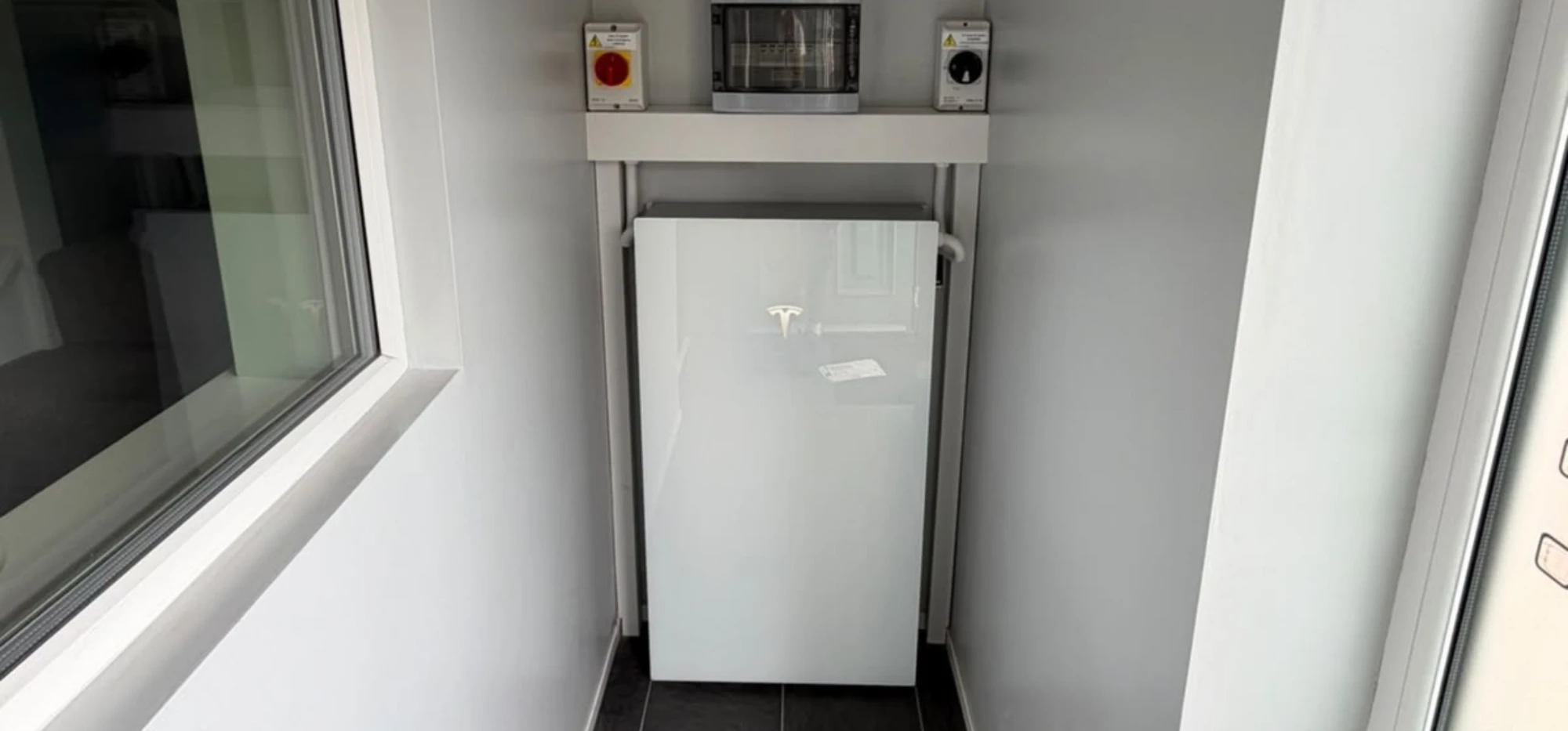 A wall-mounted unit on a plain white wall