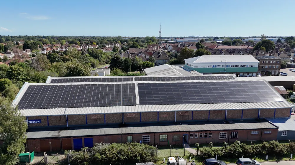 A long commercial roof covered in solar panels