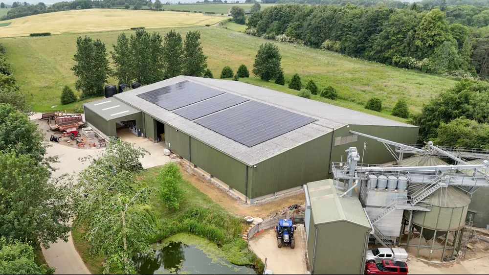 A farm building with solar panels on its roof