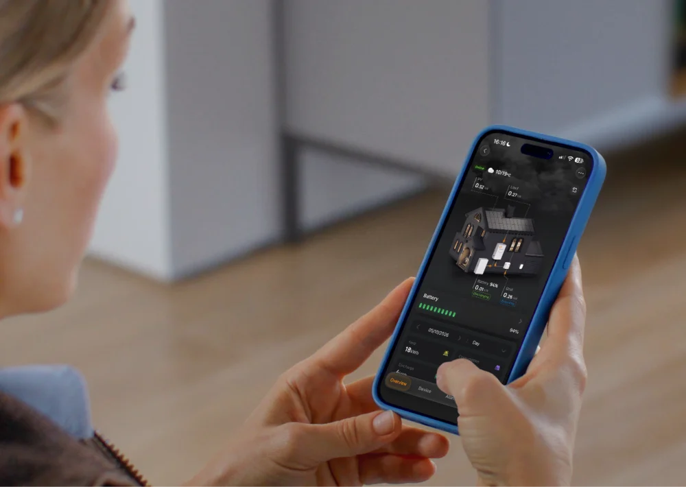 A woman checking her home's battery level in the Solis app