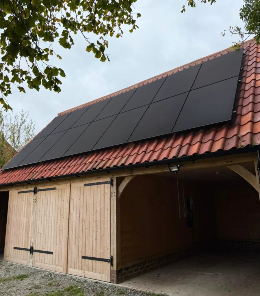 Solar panels on the roof of an oak-framed barn