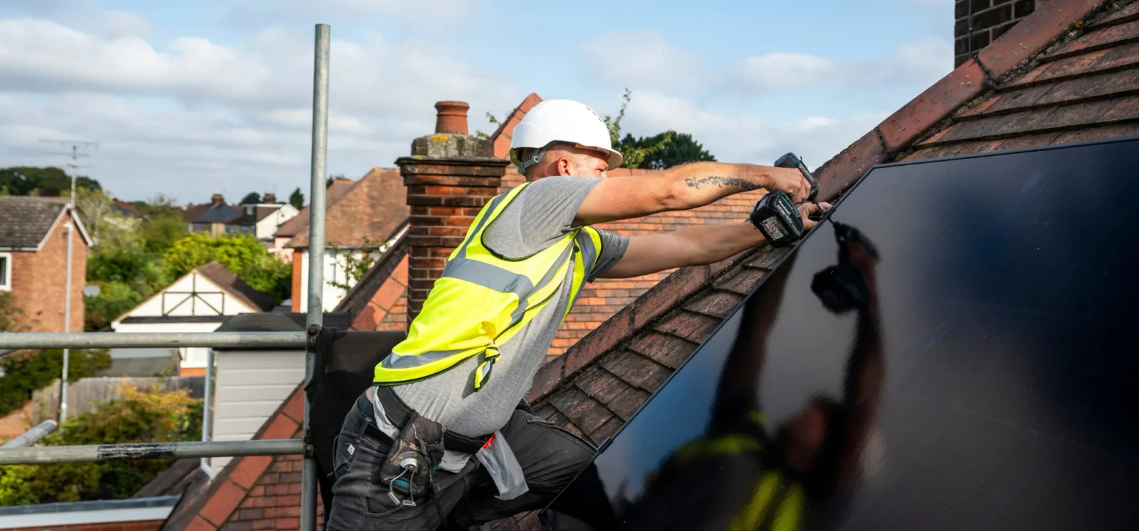 Greenscape roofing and electrical team working together on site