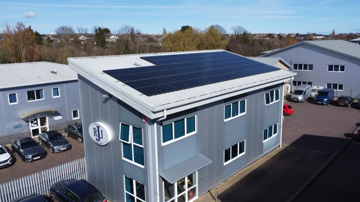 An office building with solar panels on its flat roof