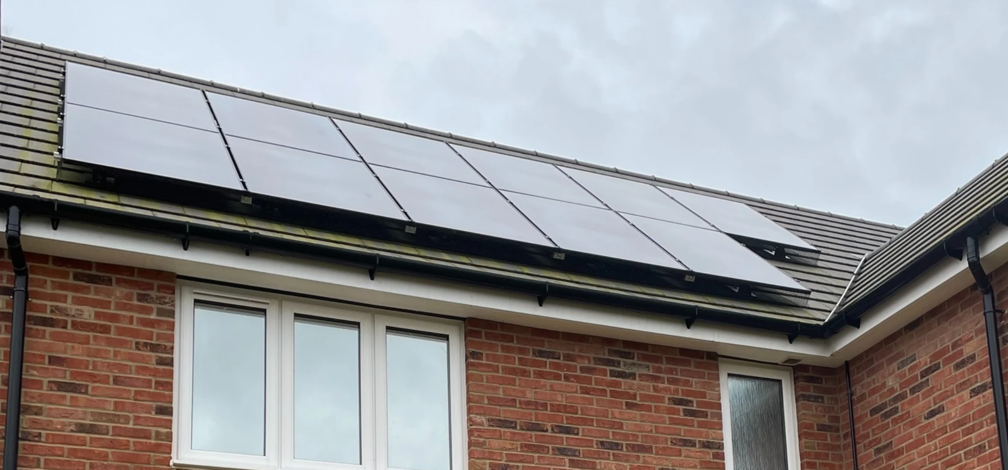 Greenscape installers working on a domestic solar array