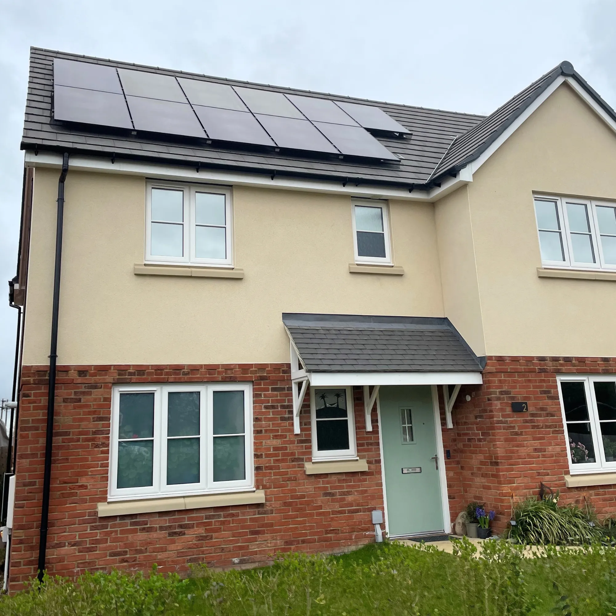 Rooftop solar across a large commercial building on the edge of town