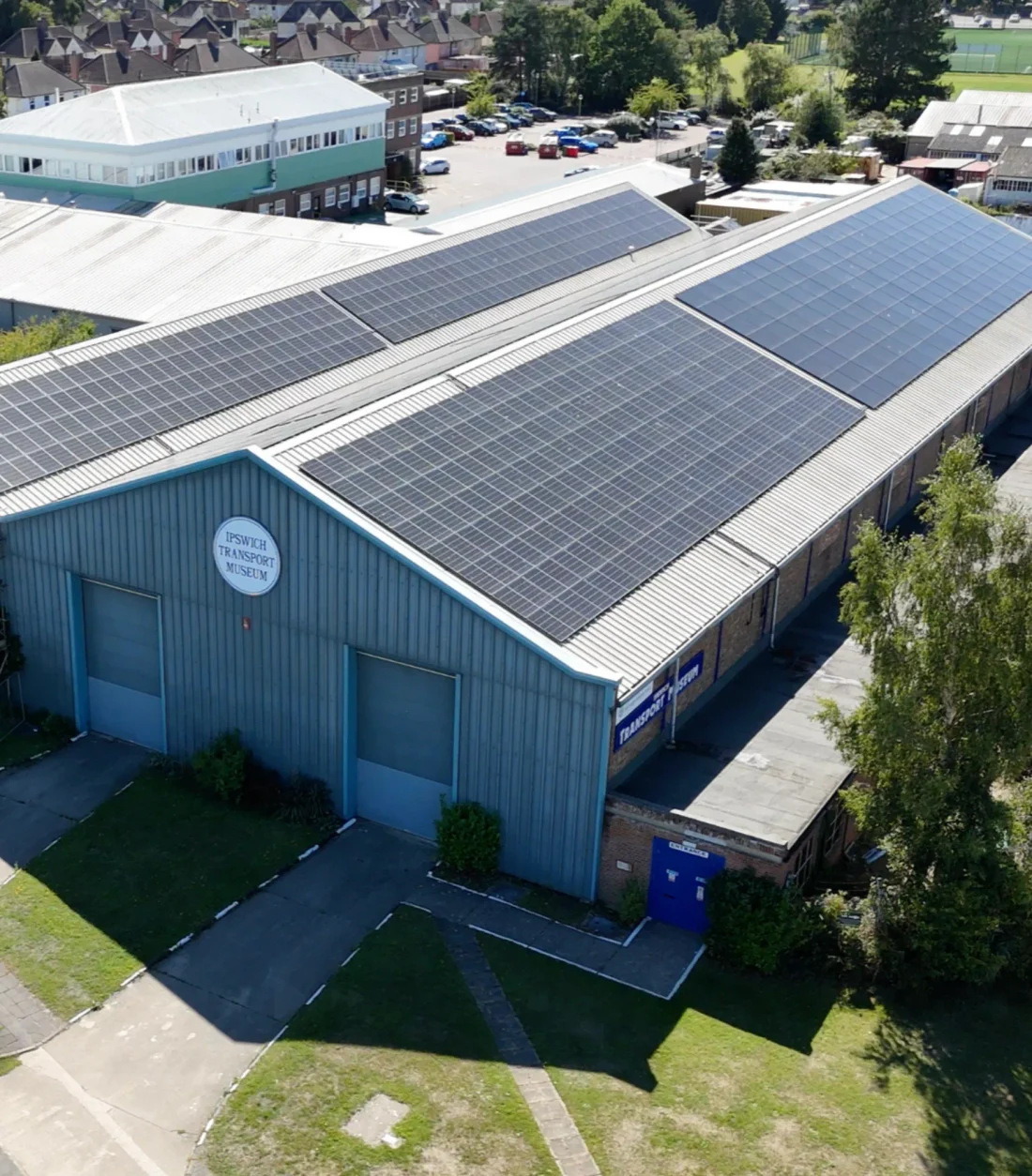 A museum building with solar panels across its roof